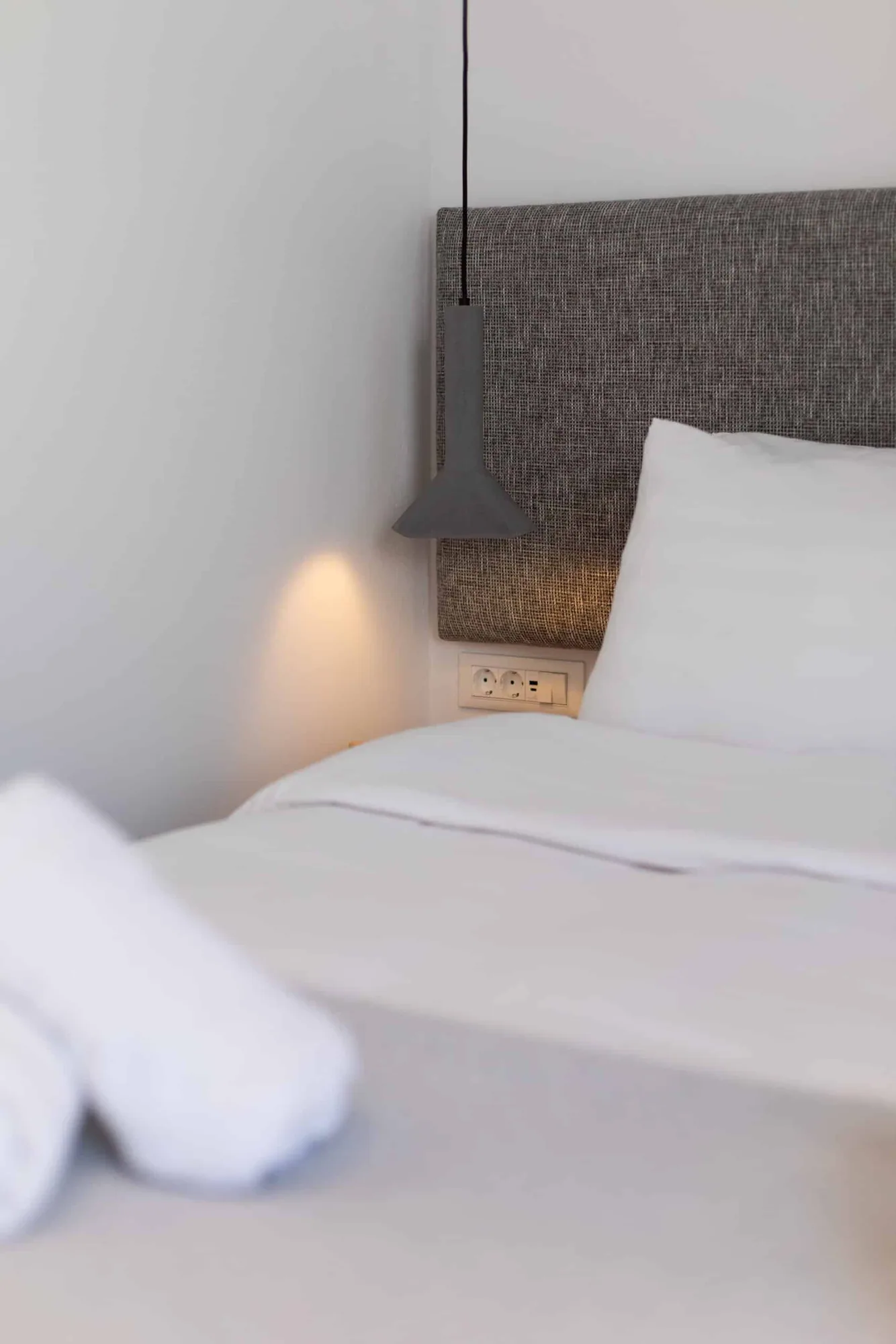 Bed and grey headboard detail